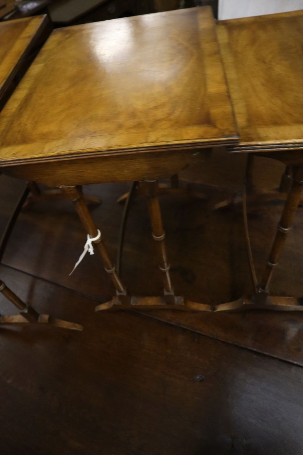 Three rectangular walnut occasional tables (formerly a nest of tables), largest width 50cm, depth 34cm, height 56cm